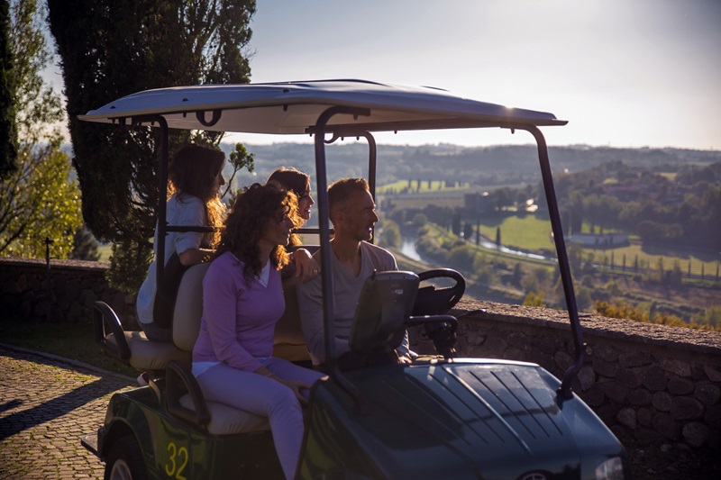 Family in golf cart