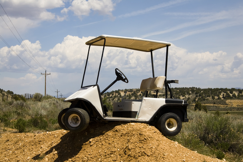 golf-cart-high-centered-on-a-dirt-mound