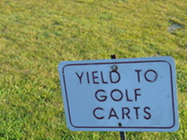 Yield to golf carts sign